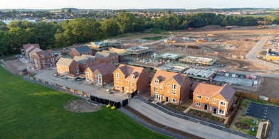 Aerial view of new build housing construction site in England